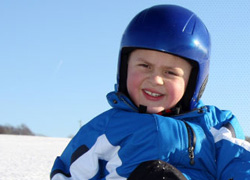 image of boy sledding